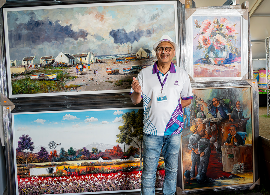 Prof Balia viewing artwork at the Aardklop exhibition